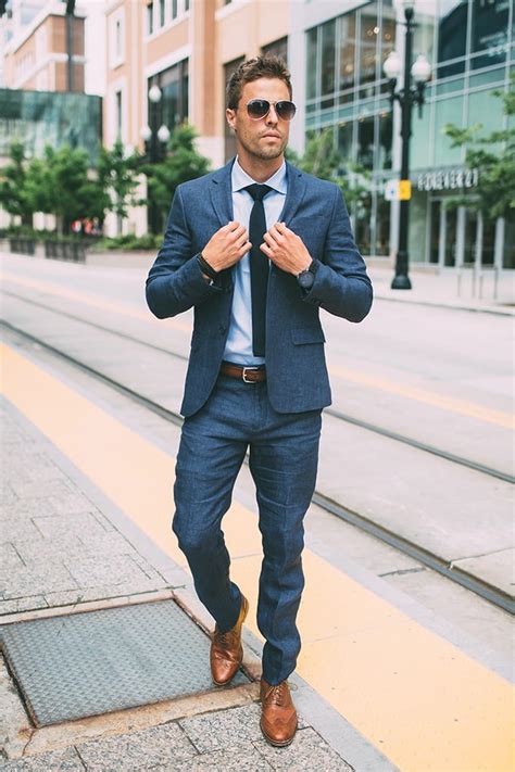 navy suit with light brown shoes|blue suit with brown boots.